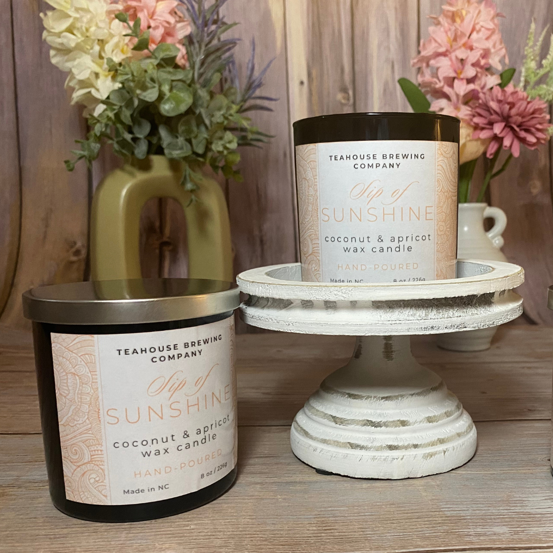 image of "sip of sunshine" tea scented candle in black container