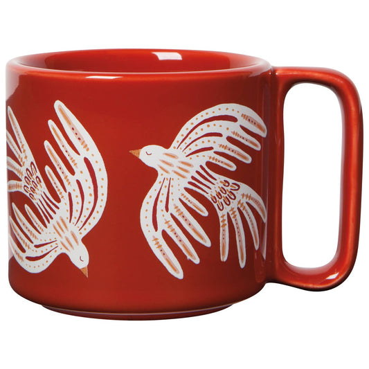 Red mug with white bird illustrations on a white background