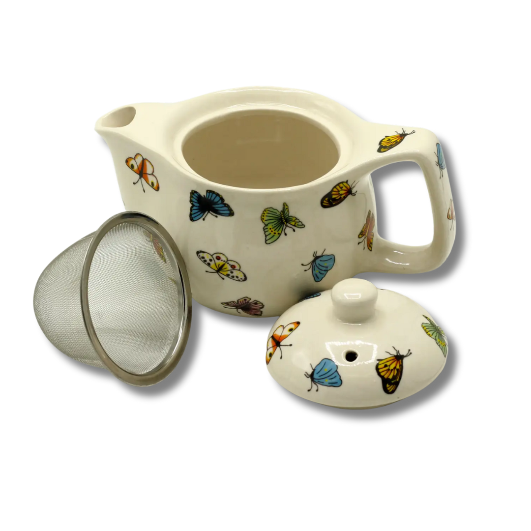 image of teapot with butterfly design, strainer and lid