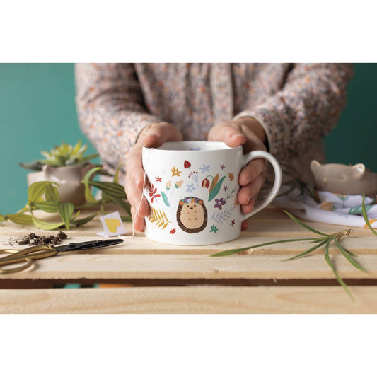 image of hedgehug tea mug held by hands