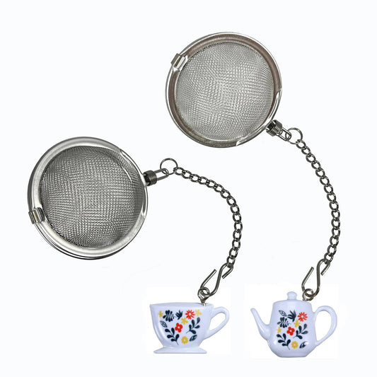 Metal tea infuser with floral teacup and teapot charm on a white background