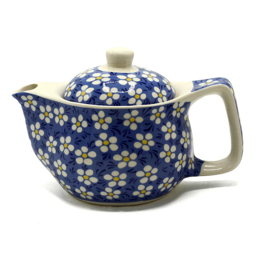 image of blue teapot with daisy design