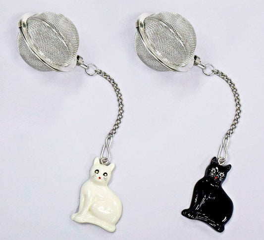 Tea infuser with mesh balls and cat-shaped ends on a white background