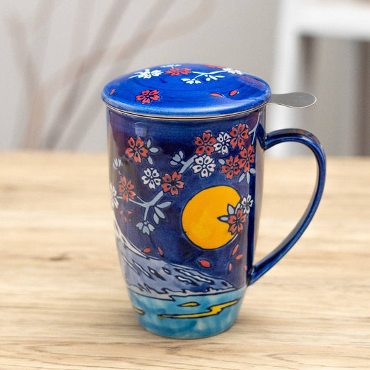Decorative mug with floral patterns on a wooden surface