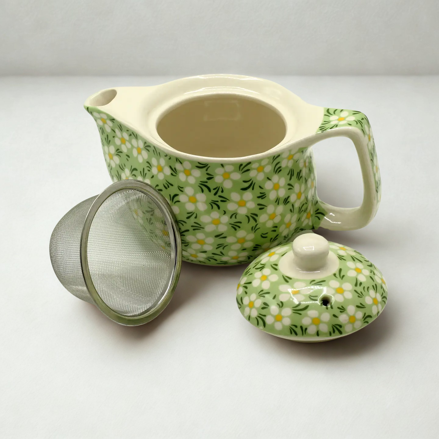 green daisy design teapot